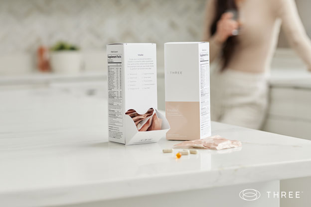 a box of vitalité supplements by three sitting on a kitchen counter